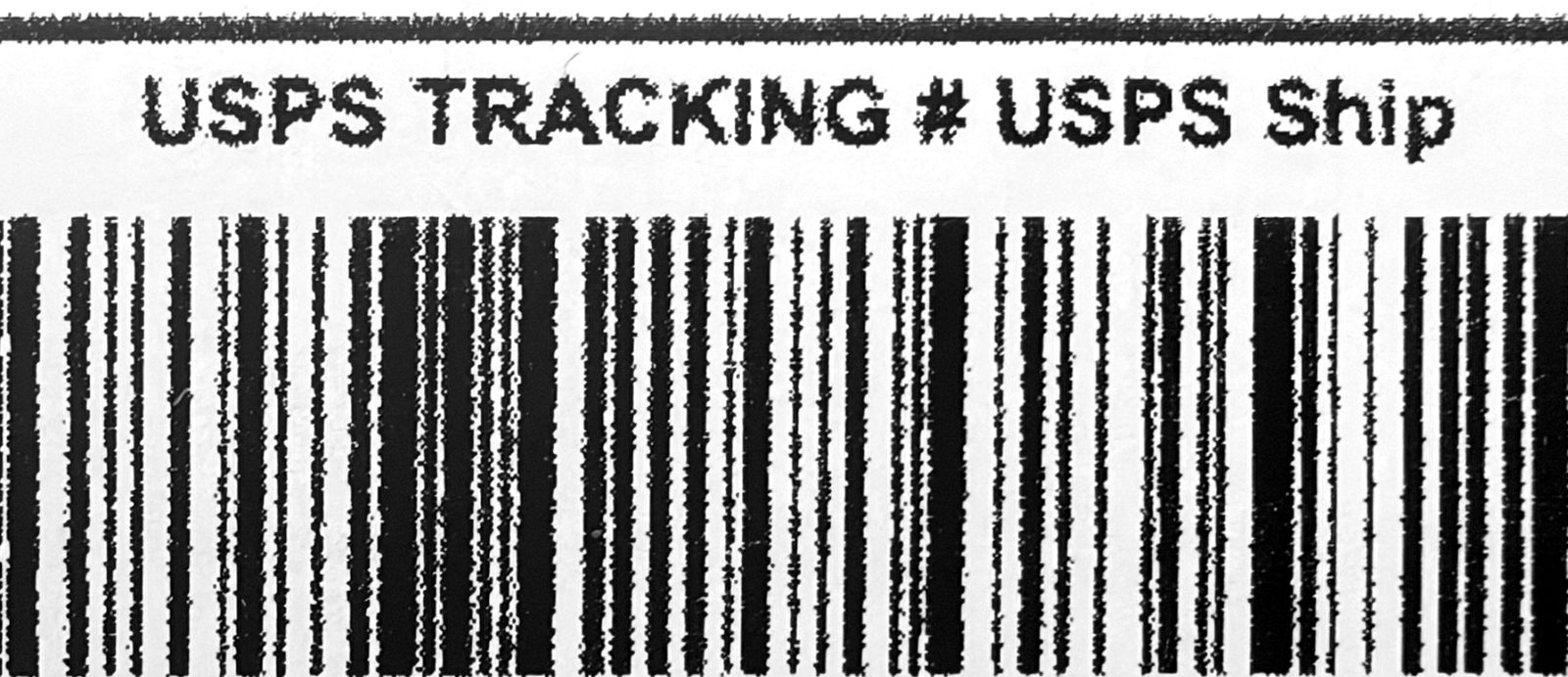 Printed with the built-in macOS driver: jagged letters and fuzzy, ragged barcode bars